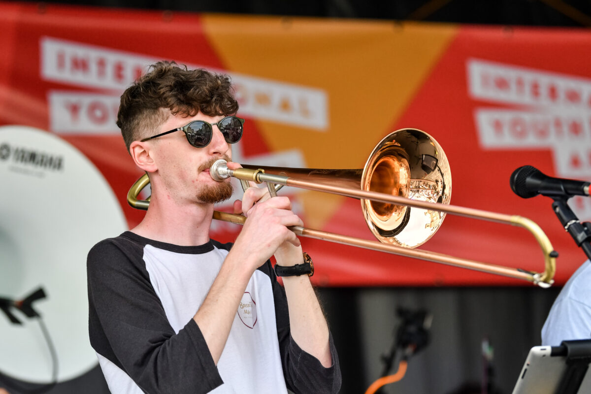 a musician playing a trombone on stage