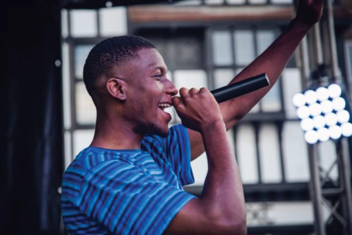 a performer singing into a microphone